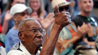 FILE - In this Sept. 12, 2019 file photo, World War II veteran Lawrence Brooks celebrates his 110th birthday at the National World War II Museum in New Orleans. Brooks celebrated his 112th birthday, Sunday, Sept. 12, 2021 with a drive-by party at his New Orleans home hosted by the National War War II Museum. Drafted in 1940, Brooks was a private in the Army’s mostly Black 91st Engineer Battalion.
