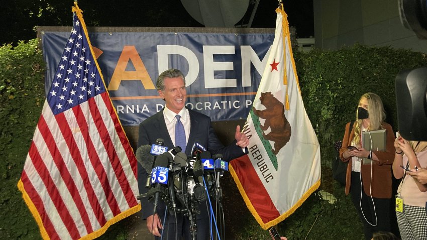 Gov. Gavin Newsom addresses a crowd in Sacramento, Calif., on Tuesday night, Sept.14, 2021. Newsom defeated an attempt to oust him from office, overcoming Republican criticism of COVID-19 restrictions that shuttered schools and businesses.