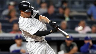 Gary Sanchez #24 of the New York Yankees connects on a second inning home run against the Texas Rangers at Yankee Stadium on Sept. 20, 2021 in New York City.