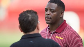 LANDOVER, MD - AUGUST 15: Former Washington Redskins running back Clinton Portis looks on from the sidelines prior to the NFL preseason game between the Cincinnati Bengals and Washington Redskins on August 15, 2019, at FedEx Field in Landover, MD.