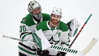Dallas Stars goalie Ben Bishop (30) puts his arms around center Tyler Seguin (91) after the Stars defeated the Anaheim Ducks 3 to 0 in a game played on January 9, 2020 at the Honda Center in Anaheim, CA.