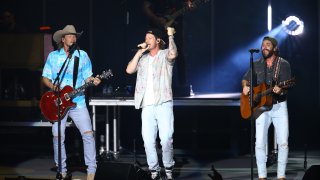 In this July 28, 2021, file photo, Brian Kelley, Tyler Hubbard of Florida Georgia Line and Thomas Rhett perform during CMA Summer Jam at Ascend Amphitheater in Nashville, Tennessee.