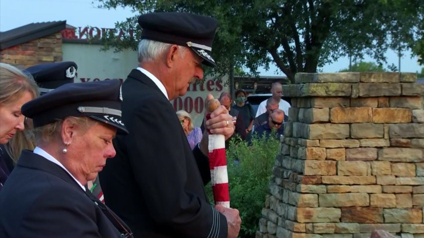 Community members, including uniformed flight attendants and pilots, came together at the 9/11 Flight Crew Memorial to remember the victims of Sept. 11, 2001.