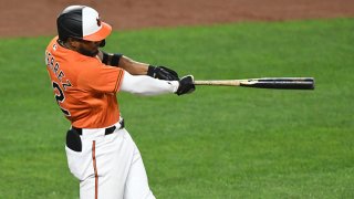 Kelvin Gutierrez #82 of the Baltimore Orioles hits a two run home run in the seventh inning during a baseball game against the Texas Rangers at Oriole Park at Camden Yards on Sept. 25, 2021 in Baltimore, Maryland.