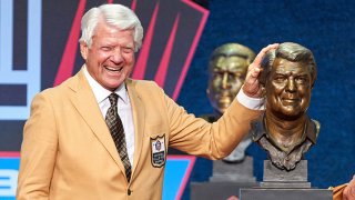 Class of 2020 member Jimmy Johnson celebrates with a bust of Johnson during the Pro Football HOF Centennial Class of 2020 enshrinement ceremonies on Aug. 7, 2021 at Tom Benson Hall of Fame Stadium, in Canton, Ohio.