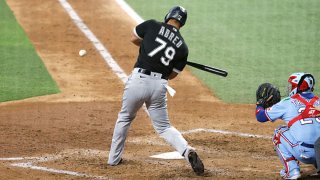 Jose Abreu #79 of the Chicago White Sox singles, driving in two runs against the Texas Rangers during the fourth inning at Globe Life Field on Sept. 19, 2021 in Arlington, Texas.