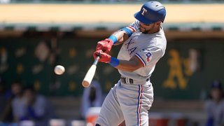 Leody Taveras #3 of the Texas Rangers hits an RBI triple scoring Jason Martin #50 against the Oakland Athletics in the top of the fourth inning at RingCentral Coliseum on Sept. 12, 2021 in Oakland, California.