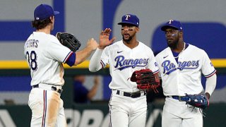 DJ Peters #38, Leody Taveras #3, and Adolis Garcia #53 of the Texas Rangers celebrate the win over the Chicago White Sox at Globe Life Field on Sept. 18, 2021 in Arlington, Texas.