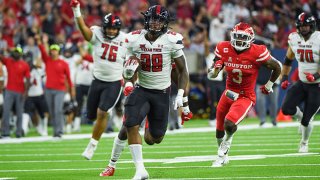 Texas Tech Red Raiders running back Tahj Brooks (28) breaks loose on a long rushing touchdown during first half action during the football game between the Texas Tech Red Raiders and University of Houston Cougars at NRG Stadium on Sept. 4, 2021 in Houston, Texas.