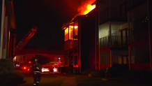 Nearly two dozen families were forced from their homes early Thursday after a fire spread through a Northeast Dallas apartment building, firefighters say.