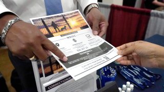 Curtis McCray points out a positive testimonial to a job applicant