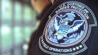 An up-close image of a U.S. Customs and Border Protection badge.