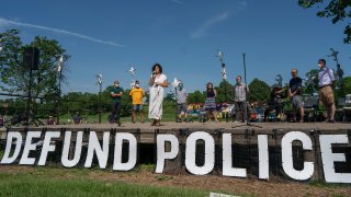 Alondra Cano, Minneapolis City Council 9th Ward member, spoke to community members at "The Path Forward" meeting at Powderhorn Park, Minneapolis, MN