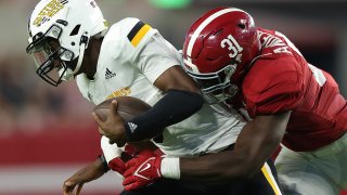 Will Anderson Jr. #31 of the Alabama Crimson Tide tackles Ty Keyes #5 of the Southern Miss Golden Eagles during the first half at Bryant-Denny Stadium on September 25, 2021 in Tuscaloosa, Alabama.