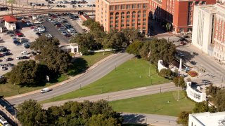 Aerial view of Dealey Plaza and the former Texas School Book Depository building in the historic West End district of downtown Dallas, Texas, is the location of the assassination of President John F. Kennedy on November 22, 1963. (Main Street, Elm Street, and Commerce Street)