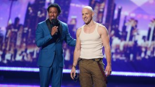 Nick Cannon and Jonathan Goodwin on stage during America's Got Talent