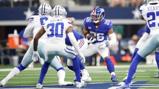 Saquon Barkley #26 of the New York Giants runs the ball during the first quarter against the Dallas Cowboys at AT&T Stadium on Oct. 10, 2021 in Arlington, Texas.