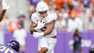 Texas Longhorns running back Bijan Robinson (5) runs through the line of scrimmage during the game between the TCU Horned Frogs and the Texas Longhorns on Oct. 2, 2021 at Amon G. Carter Stadium in Fort Worth, Texas.