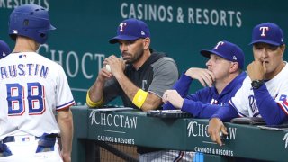 Chris Woodward #8 of the Texas Rangers watches the game against the Colorado Rockies at Globe Life Field on Sept. 1, 2021 in Arlington, Texas.