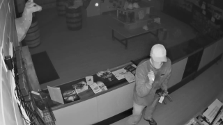 Law enforcement officials are looking for a man suspected of stealing 21 firearms from a business in Denton County that happened in September.