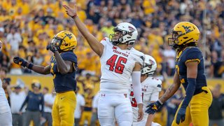 Texas Tech Red Raiders place kicker Jonathan Garibay (46) watches as his go-ahead 32-yard field goal splits the uprights with 0:18 left in the fourth quarter of the college football game between the Texas Tech Red Raiders and the West Virginia Mountaineers on Oct. 2, 2021, at Mountaineer Field at Milan Puskar Stadium in Morgantown, West Virginia.