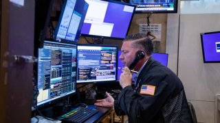 A trader on the floor of the New York Stock Exchange (NYSE), on Thursday, Nov. 18, 2021.