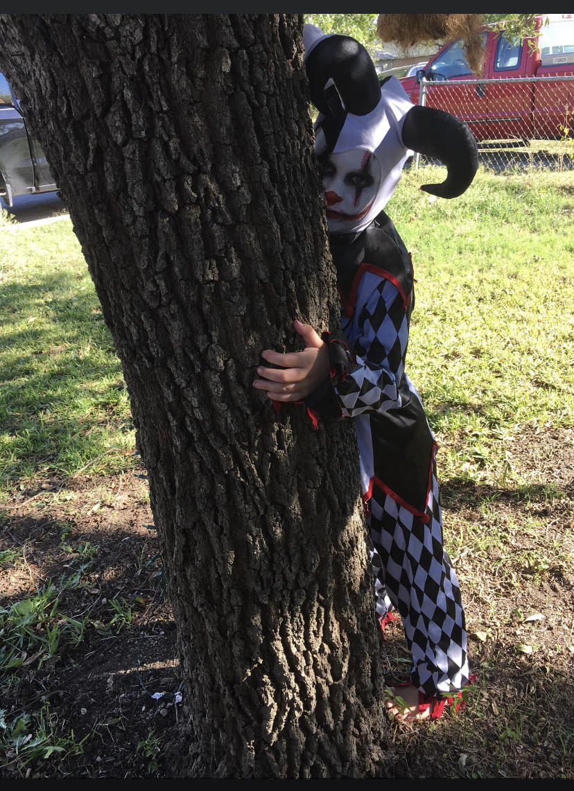 My grandson dressed as a creepy jester. Make up done by his momma