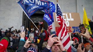 FILE – In this Jan. 6, 2021, file photo insurrections loyal to President Donald Trump riot outside the Capitol in Washington. The House panel investigation of the riot at the U.S. Capitol issued sweeping document requests on Friday, Aug. 27, to social media companies, expanding the committee’s investigation as it seeks to examine the events leading to January’s insurrection.