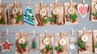 A unique advent calendar for Christmas on the background of a gray wall.