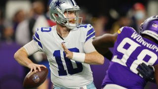 MINNEAPOLIS, MINNESOTA - OCTOBER 31: Cooper Rush #10 of the Dallas Cowboys throws a pass against the Minnesota Vikings at U.S. Bank Stadium on October 31, 2021 in Minneapolis, Minnesota. (Photo by Adam Bettcher/Getty Images)