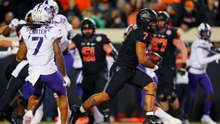 Running back Jaylen Warren #7 of the Oklahoma State Cowboys finds an opening up the middle for a touchdown run against the Texas Christian University Horned Frogs in the second quarter at Boone Pickens Stadium on Nov. 13, 2021 in Stillwater, Oklahoma.