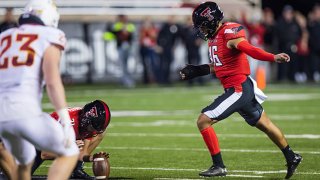 Kicker Jonathan Garibay #46 of the Texas Tech Red Raiders kicks a game-winning, 62-yard field goal as time expires during the second half of the college football game against the Iowa State Cyclones at Jones AT&T Stadium on Nov. 13, 2021 in Lubbock, Texas.