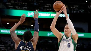 Kristaps Porzingis #6 of the Dallas Mavericks shoots the ball against Monte Morris #11 of the Denver Nuggets in the first quarter at American Airlines Center on Nov. 15, 2021 in Dallas, Texas.