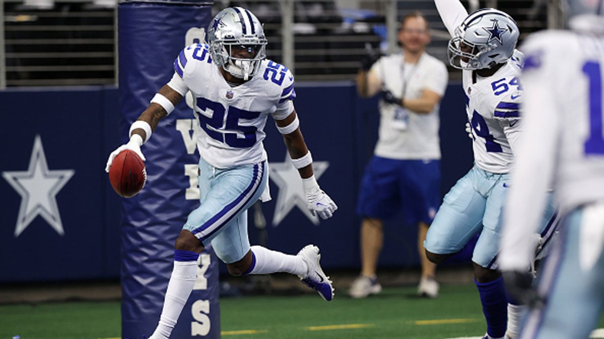 Dallas Cowboys' Nahshon Wright (25) defends as safety Markquese Bell (41)  gains yards after intercdepting a Seattle Seahawks pass in the second half  of a preseason NFL football game in Arlington, Texas