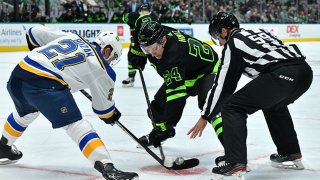 Roope Hintz #24 of the Dallas Stars tries to win a face off against Tyler Bozak #21 of the St. Louis Blues at the American Airlines Center on Nov. 20, 2021 in Dallas, Texas.