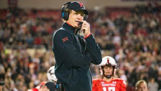 Interim head coach Sonny Cumbie of the Texas Tech Red Raiders stands on the sideline before the college football game against the Oklahoma State Cowboys at Jones AT&T Stadium on Nov. 20, 2021 in Lubbock, Texas.