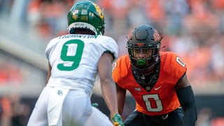 Oklahoma State Cowboys safety Tanner McCalister (2) lines up with Baylor Bears wide receiver Tyquan Thornton (9) on Oct. 2, 2021 at Boone Pickens Stadium in Stillwater, Oklahoma.