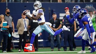 CeeDee Lamb #88 of the Dallas Cowboys catches the ball for a touchdown during the second quarter against the New York Giants at AT&T Stadium on October 10, 2021 in Arlington, Texas.