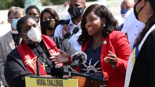 FILE: Texas State Representatives Jasmine Crockett (D-District 100) speaks alongside Rev. William Barber, Co-Chair of the Poor People’s Campaign, and fellow representatives, as they prepare to deliver a petition to Senate Majority Leader Charles Schumer calling for an end to the filibuster, the passage of the For The People Act and restoring the Voting Rights Act, at the U.S. Supreme Court on Aug. 12, 2021 in Washington, DC.