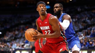 Jimmy Butler #22 of the Miami Heat handles the ball as Tim Hardaway Jr. #11 of the Dallas Mavericks defends in the first half at American Airlines Center on Nov. 2, 2021 in Dallas, Texas. The Heat won 125-110.