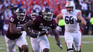 Micheal Clemons #2 of the Texas A&M Aggies returns a fumble 24 yards for a touchdown in the fourth quarter against the Auburn Tigers at Kyle Field on Nov. 6, 2021 in College Station, Texas.