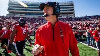 Interim head coach Sonny Cumbie of the Texas Tech Red Raiders stands on the sideline before the college football game against the Iowa State Cyclones at Jones AT&T Stadium on Nov. 13, 2021 in Lubbock, Texas.
