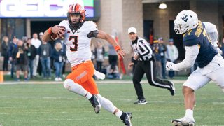 Oklahoma State Cowboys Quarterback Spencer Sanders (3) runs with the ball during the second half of the College Football game between the Oklahoma State Cowboys and the West Virginia Mountaineers on Nov. 6, 2021, at Mountaineer Field at Milan Puskar Stadium in Morgantown, West Virginia.