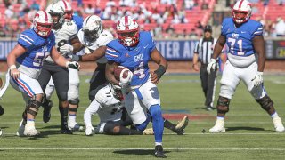 Southern Methodist Mustangs running back Tre Siggers (4) runs to the end zone for a touchdown during the game between SMU and UCF on Nov. 13, 2021 at Gerald J. Ford Stadium in Dallas, Texas.