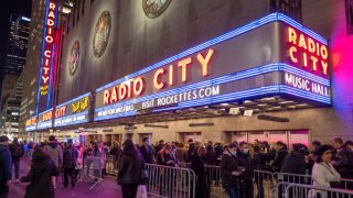 People wait in long lines to see the Radio City Rockettes Christmas Spectacular on Dec, 14, 2021 in New York City. The show announced on Dec. 17 that it is canceling the rest of this season’s performances due to rising Covid-19 cases.