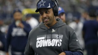 Dallas Cowboys defensive line coach Aden Durde walks on the sideline during the first half of an NFL football game against the Atlanta Falcons in Arlington, Texas, Nov. 14, 2021.