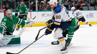 Dallas Stars goaltender Jake Oettinger (29) defends as St. Louis Blues center Ryan O'Reilly (90)