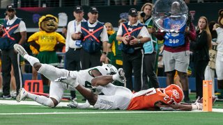Oklahoma State Cowboys running back Dezmon Jackson (27) just misses a dive for the end zone in the last seconds of the game against the Baylor Bears on Dec. 4, 2021 at AT&T Stadium in Dallas Texas.