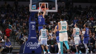 Kristaps Porzingis #6 of the Dallas Mavericks dunks the ball against the Charlotte Hornets in the first half at American Airlines Center on December 13, 2021 in Dallas, Texas.