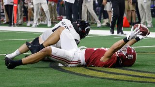 Cameron Latu #81 of the Alabama Crimson Tide celebrates after scoring a touchdown against the Cincinnati Bearcats during the fourth quarter in the Goodyear Cotton Bowl Classic for the College Football Playoff semifinal game at AT&T Stadium on December 31, 2021 in Arlington, Texas.